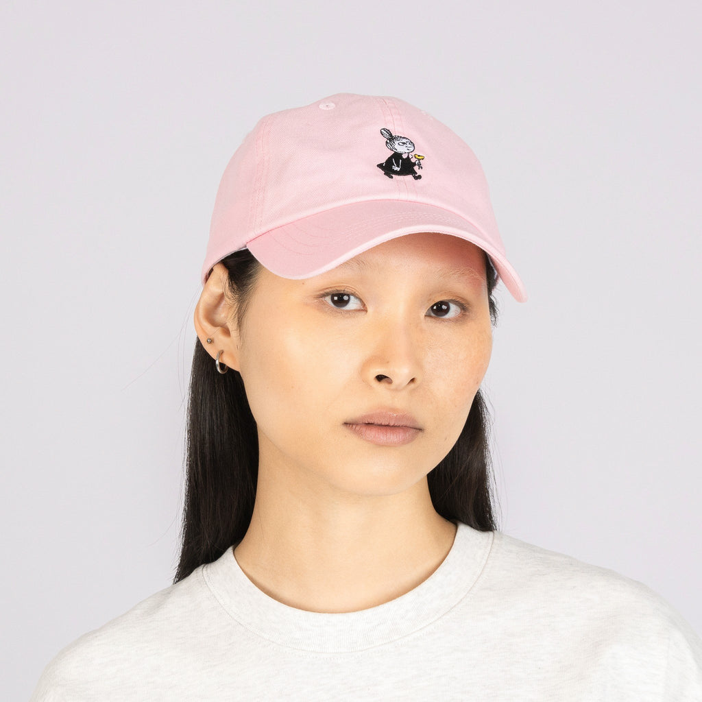 1. Woman wearing Little My Dad Cap in pink by Moomin, front view in studio