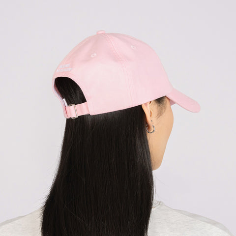 5. Woman wearing pink Moomin Dad Cap, back view in studio