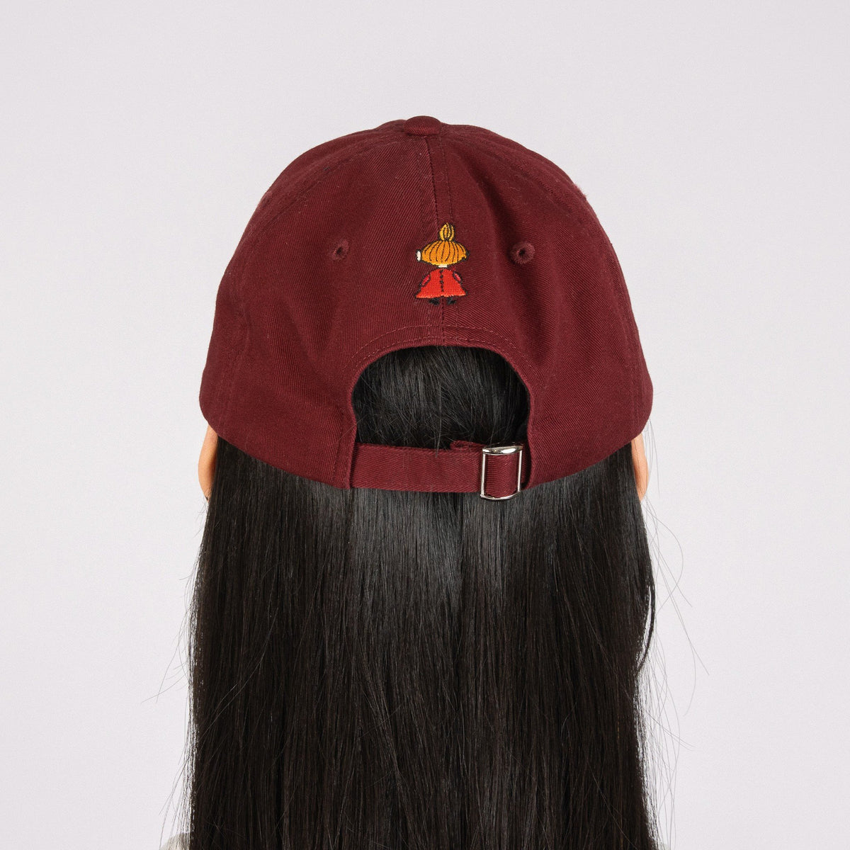 5. Studio back view of red Little My Dad Cap by Moomin, highlighting embroidery and strap