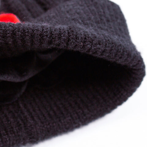 3. Interior view of kids' black beanie showing soft fleece lining