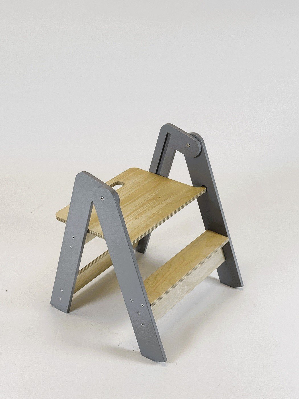 2. Wooden step stool with grey sides and natural wood steps on white background