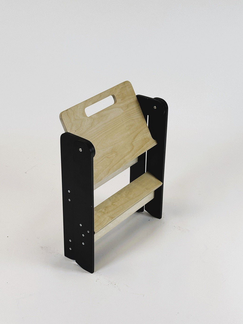 3. Folded wooden step stool with black sides and natural wood steps on white background