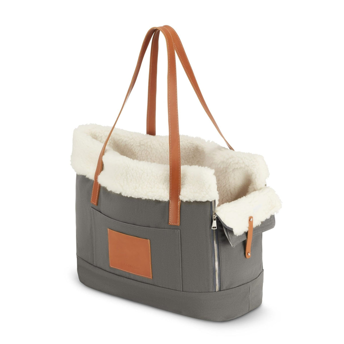 2. Grey Liiva dog carrier with brown leather straps and white wool lining shown in studio setting