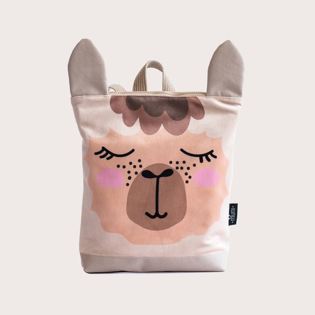 5. Muni llama backpack in studio, featuring velvet fabric and llama face design