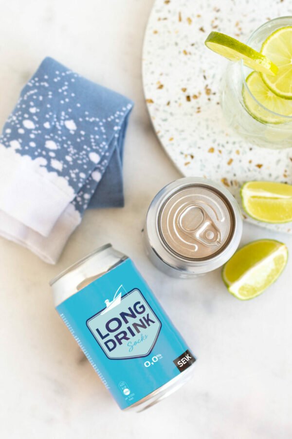 6. SEIK Long Drink Socks in blue with white speckles, styled with Long Drink can and lime slices
