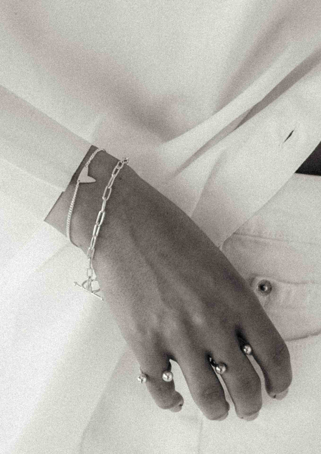 2. Close-up of Love Bracelet in sterling silver, highlighting minimalist design and chain detail