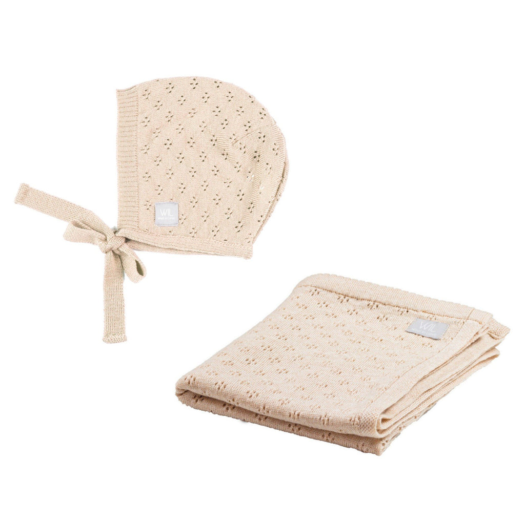 4. Beige merino wool baby bonnet and blanket set on a white background