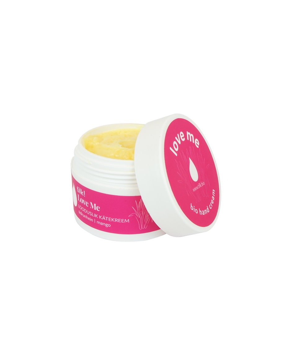 3. Open jar of Tilk! Love Me Moisturising Hand Cream with mango and lemongrass, showing creamy texture