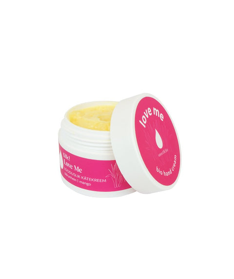 3. Open jar of Tilk! Love Me Moisturising Hand Cream with mango and lemongrass, showing creamy texture