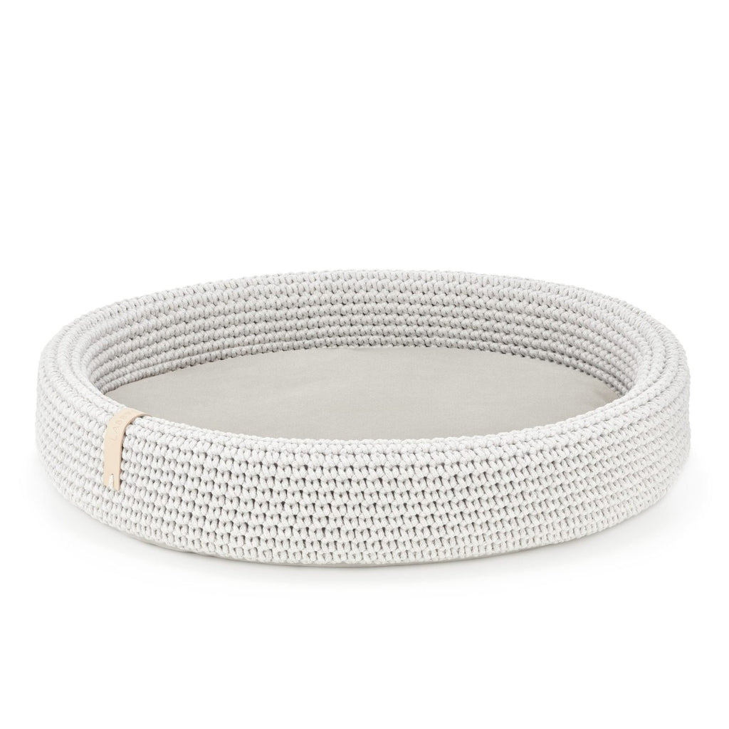 3. Studio shot of light grey oval braided cotton dog bed with removable cushion