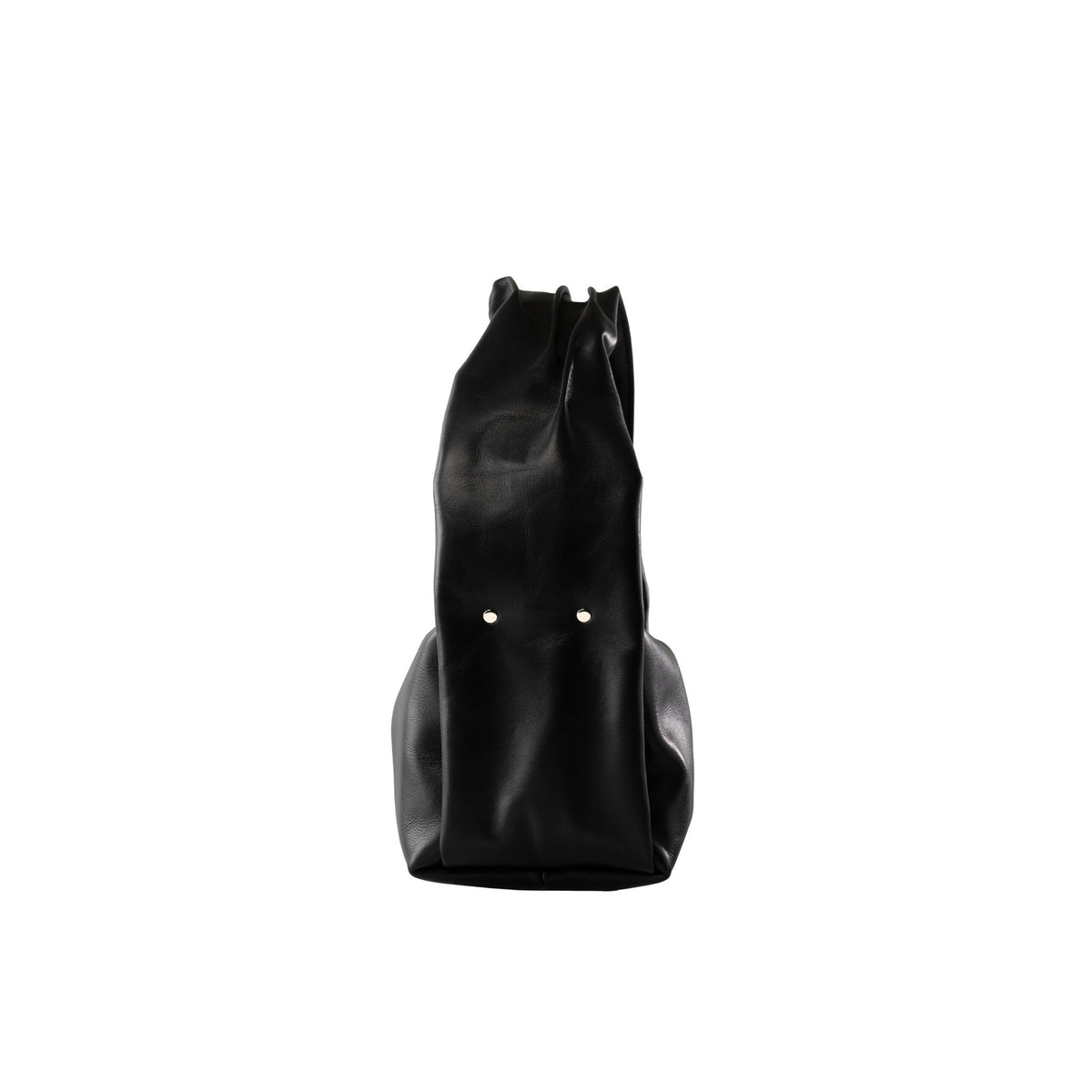 6. Side view of PYKOK Soft Leather Baguette Handbag Luna in black, highlighting natural leather texture