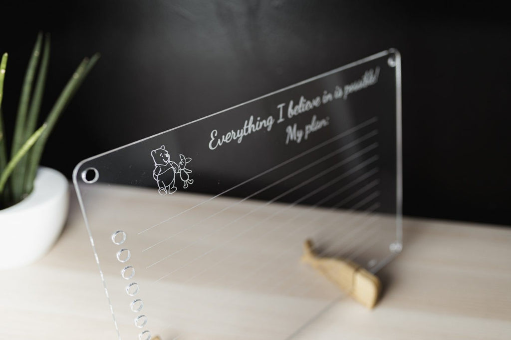 9. Angled view of Luula acrylic planner with motivational text and wooden stand