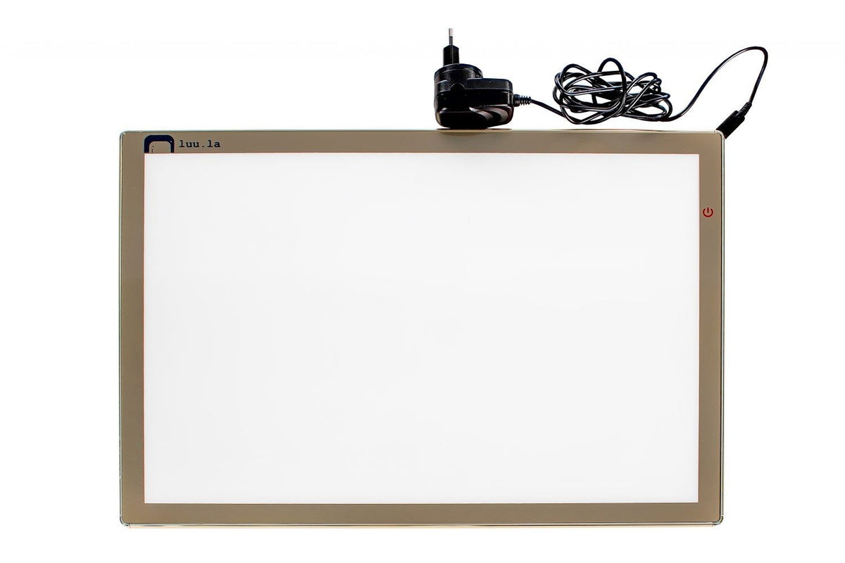 2. Luula light board panel with golden aluminum frame and USB-C power cord on white background