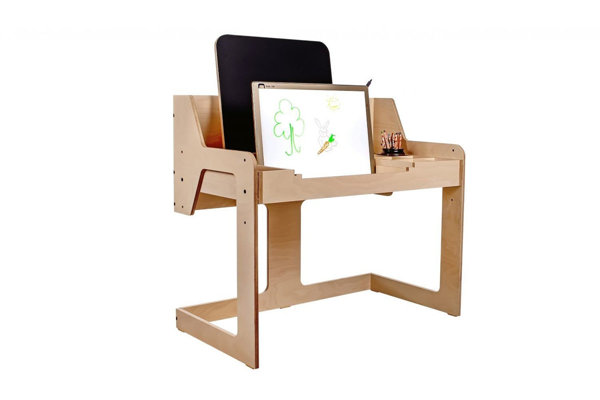 1. Side view of Luula light board on wooden desk with colorful drawings