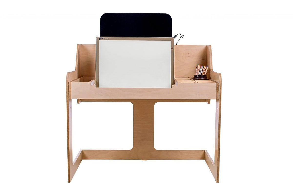 1. Front view of Luula light board on wooden desk with storage compartments