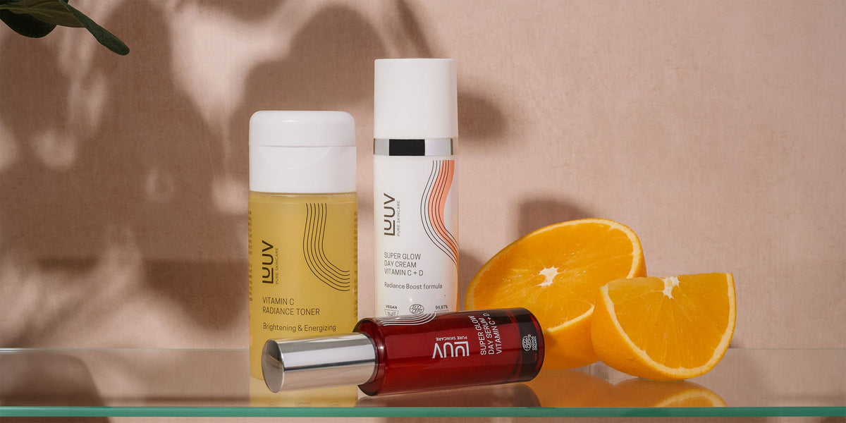 4. LUUV skincare set featuring Super Glow Day Cream, Vitamin C Radiance Toner, and Serum, styled with oranges