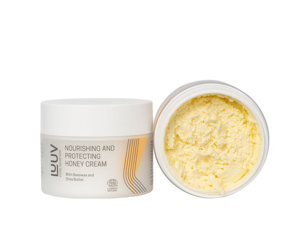 2. LUUV Nourishing and Protecting Honey Cream with open lid, showcasing creamy texture, on black background