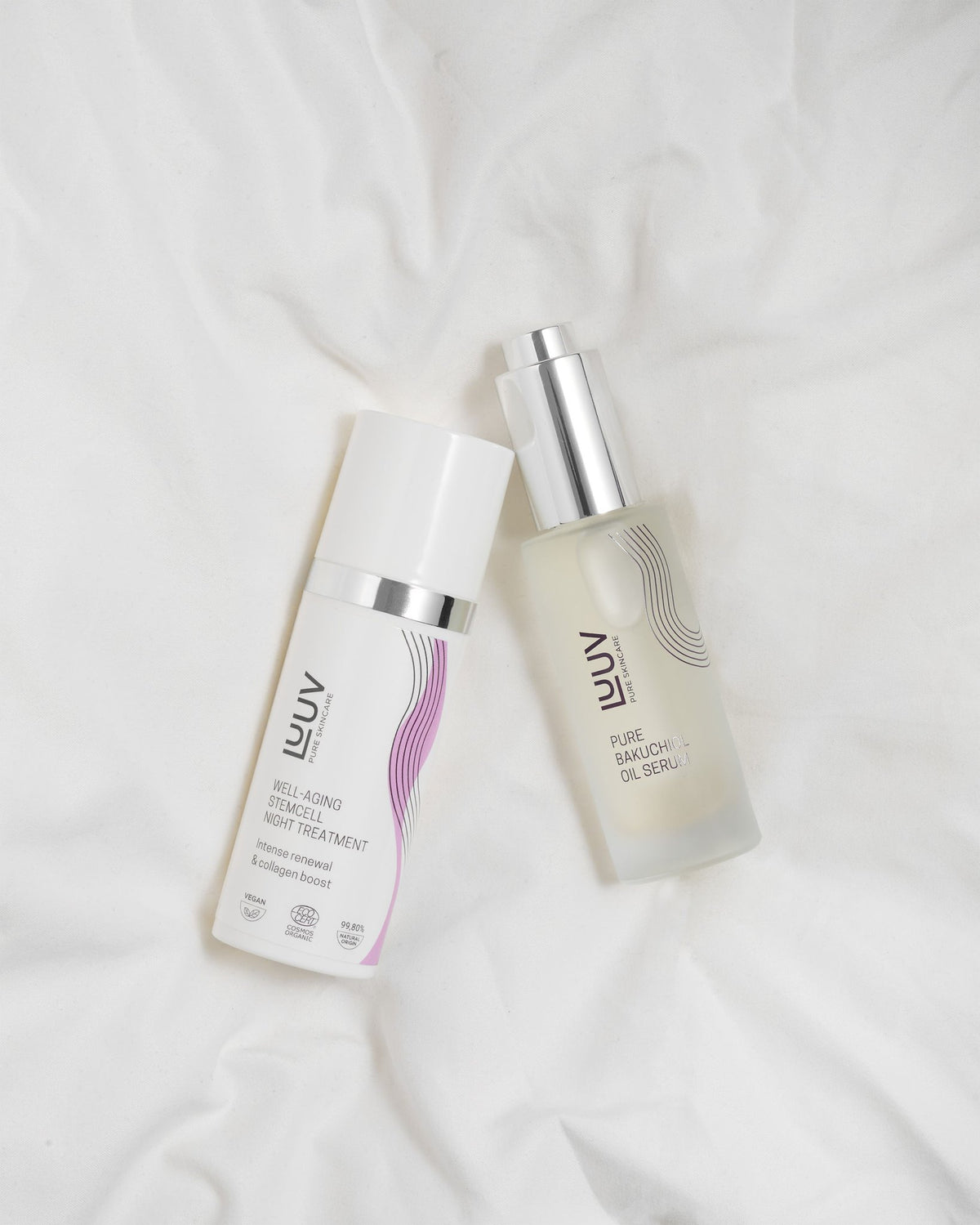 2. LUUV Well-aging Stemcell Night Treatment and Pure Bakuchiol Oil Serum bottles on white fabric