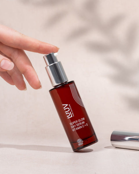 1. LUUV Super Glow Day Serum Vitamin C + D in hand, showcasing sleek bottle design