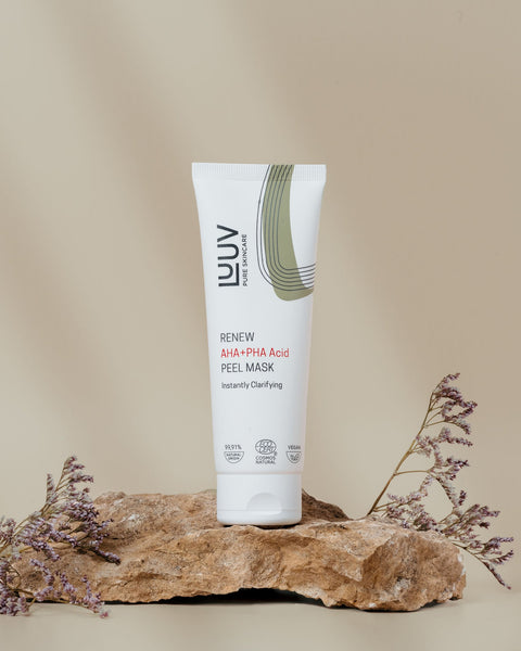 1. LUUV AHA+PHA Acid Peel Mask, 75 ml, shown on a natural stone with floral accents, highlighting its ECOCERT/COSMOS certification