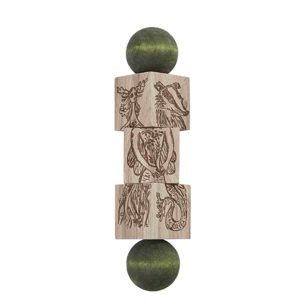 4. Magic Forest wooden spinning puzzle with engraved animal designs and green ends on a white background
