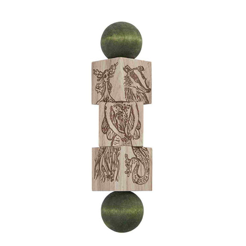 4. Magic Forest wooden spinning puzzle with engraved animal designs and green ends on a white background