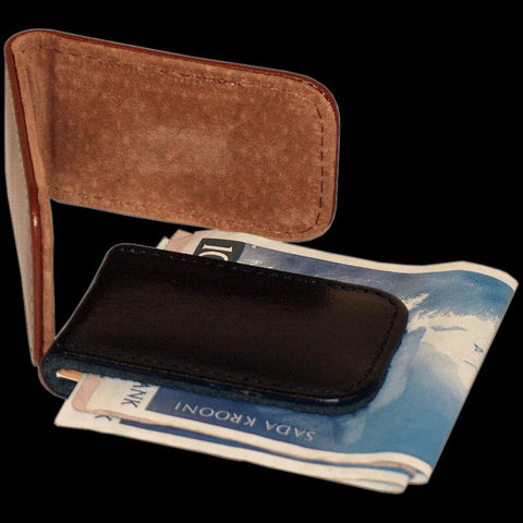 1. Papillon magnetic money clip in black leather holding cash, showcasing minimalist design