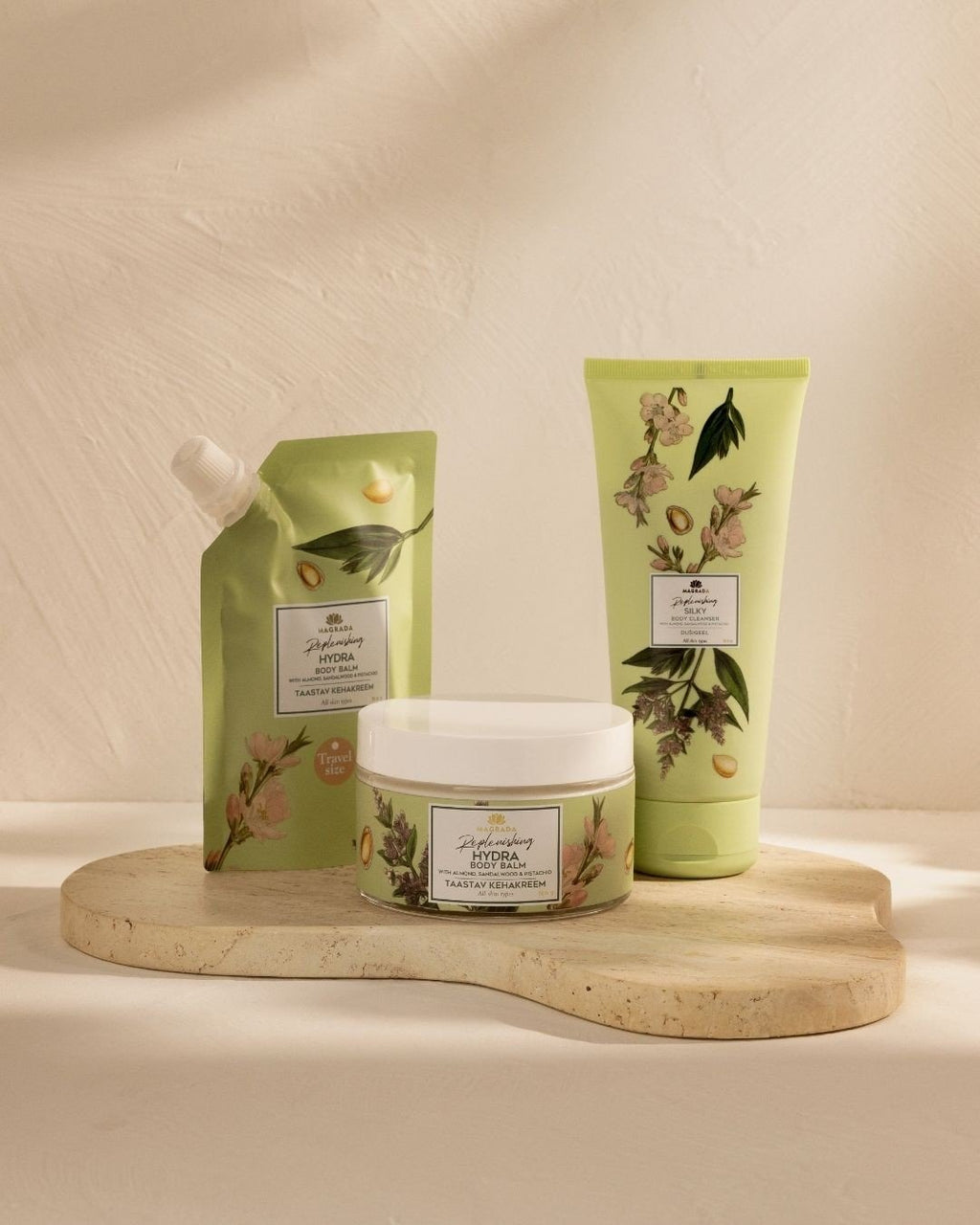 3. Magrada X Lauren skincare set including moisturizing shower gel, pouch, and jar, displayed on stone tray