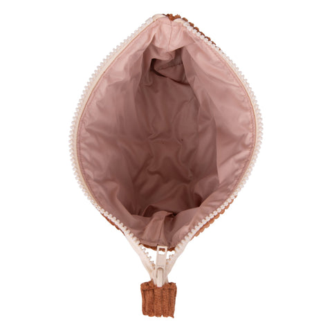 5. Inside view of small caramel makeup bag with pink lining and open zipper