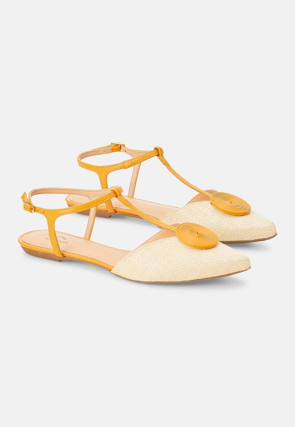 9. Angled view of Mangará Acerola women's sandals in natural color with yellow accents, studio setting