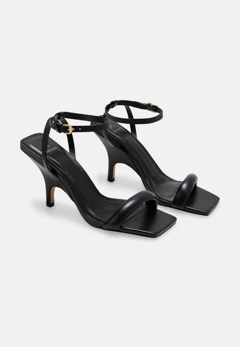 5. Studio image of Mangará Cortiça black high heel sandals with adjustable ankle strap