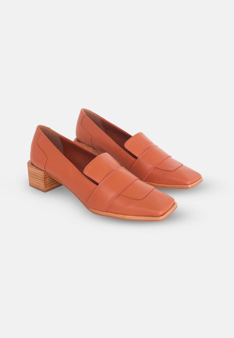 5. Pair of women's orange Mangará Louro Leather Loafers with block heel in studio