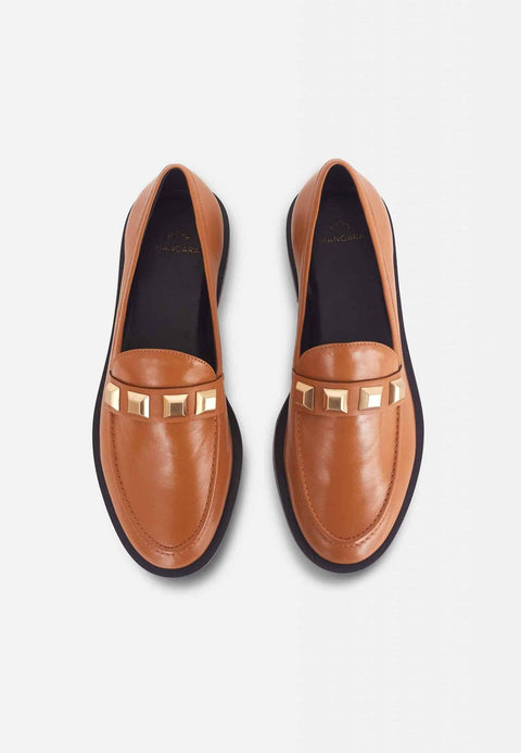 4. Studio shot of brown Mangará Caete leather loafers with metal studs, top view