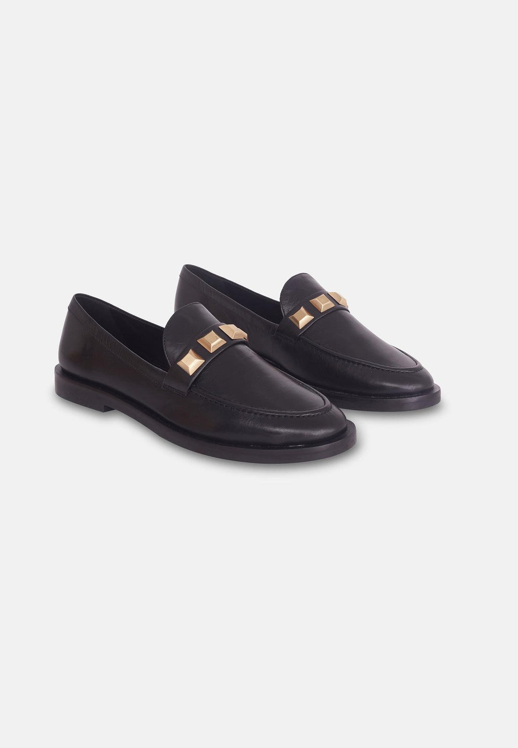 10. Studio shot of black Mangará Caete leather loafers with metal studs, top view