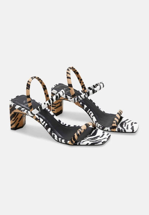 3. Studio side view of Mangará women's sandals in animal print with 6.5cm block heel