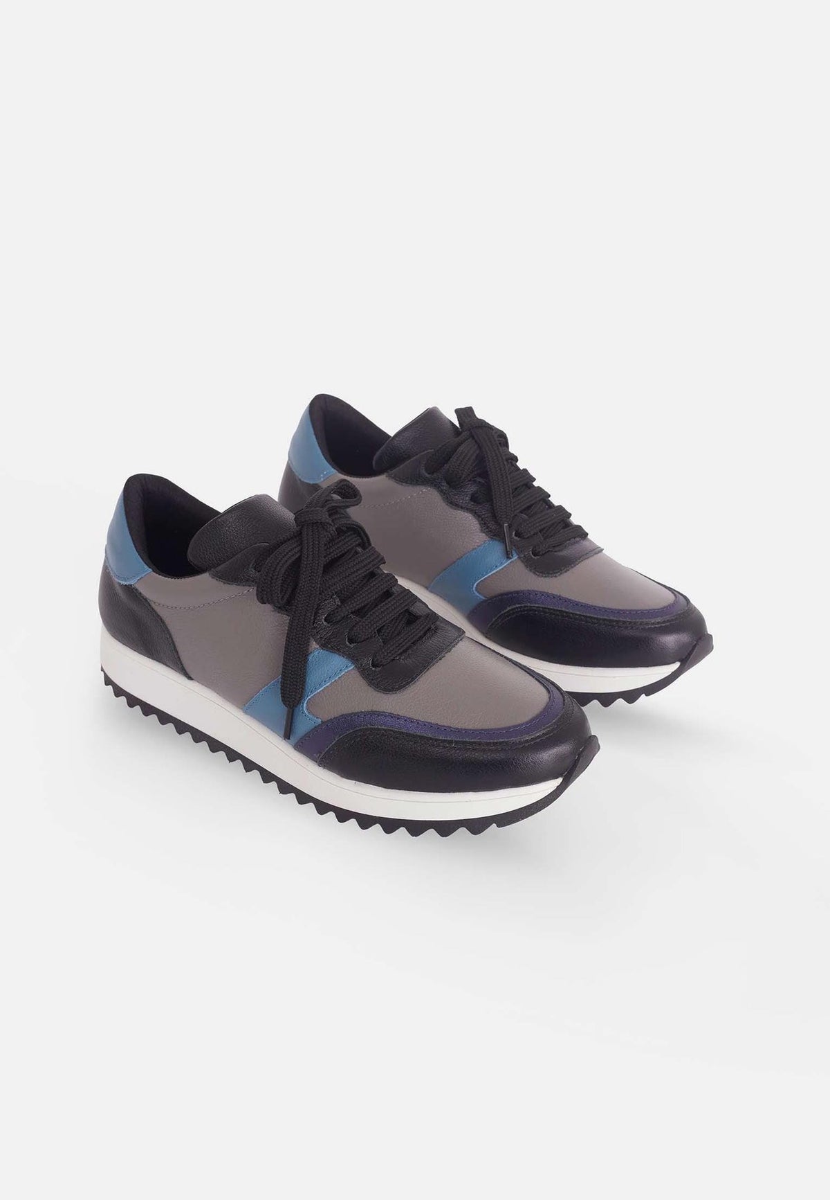 6. Pair of women's Mangará Buriri sneakers in grey, blue, and black shown from side angle