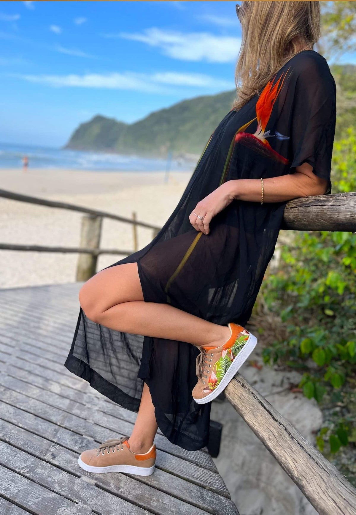 12. Studio shot of women's Mangará embroidery suede sneakers in beige, side view with floral embroidery