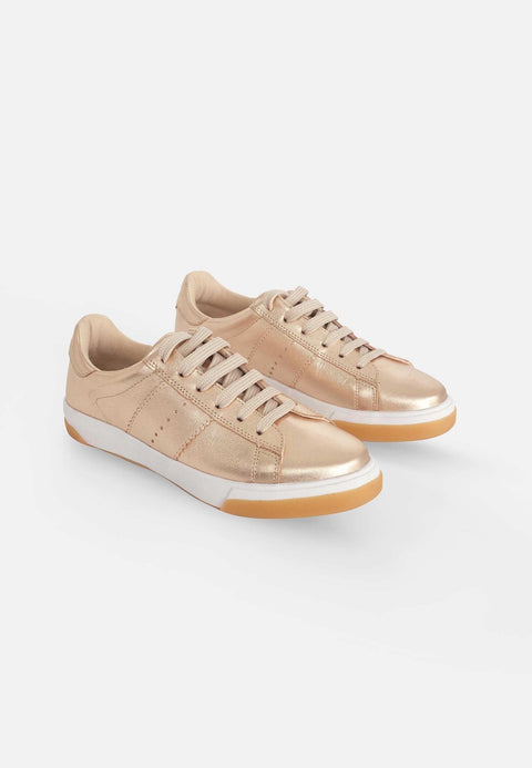 5. Pair of Mangará women's metallic golden leather sneakers with lace-up front, shown in studio