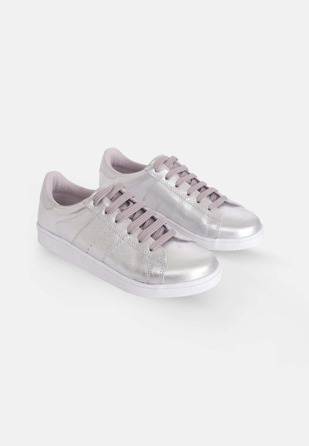 3. Pair of Mangará women's metallic silver leather sneakers in studio setting, highlighting sleek design