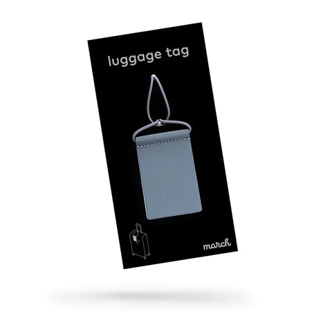 4. Packaging of MARCH Reflective Luggage Tag, featuring product design and branding