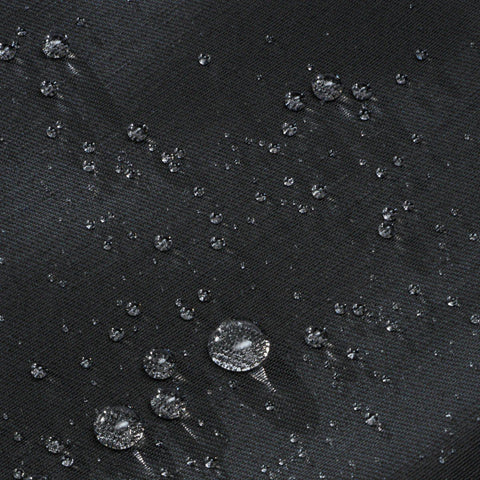 5. Close-up of water-resistant fabric on March Design Studio's Reflective Backpack DOG, showing water droplets