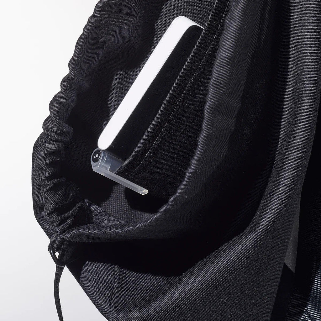 4. Close-up of inside pocket in March Design Studio's Water Resistant Reflective Backpack SPLASH, highlighting organization feature