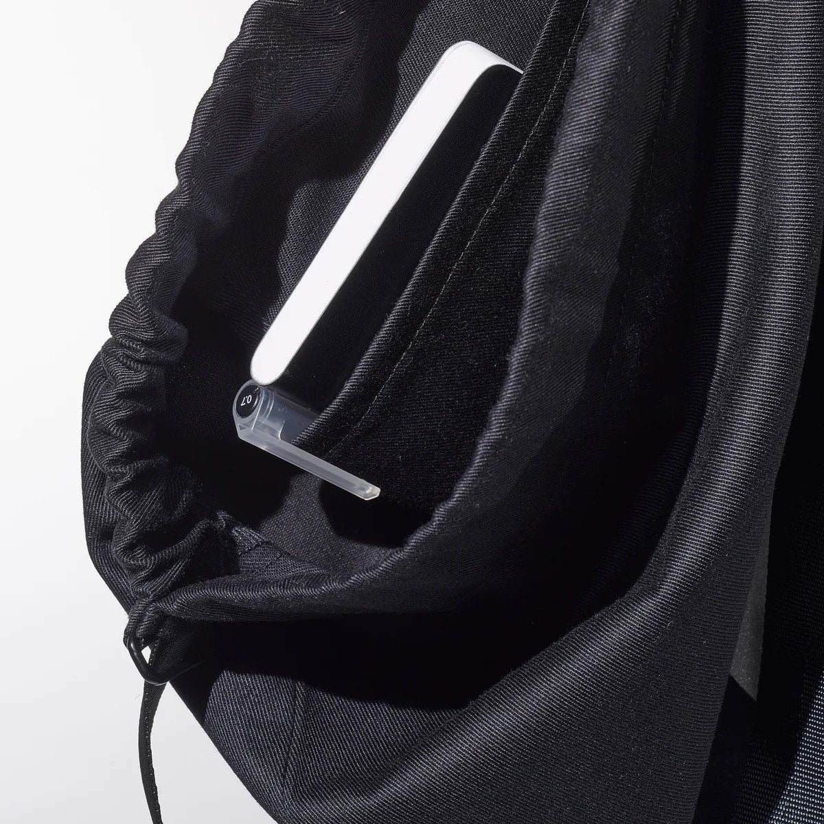 4. Close-up of inside pocket in March Design Studio's Water Resistant Reflective Backpack SPLASH, highlighting organization feature