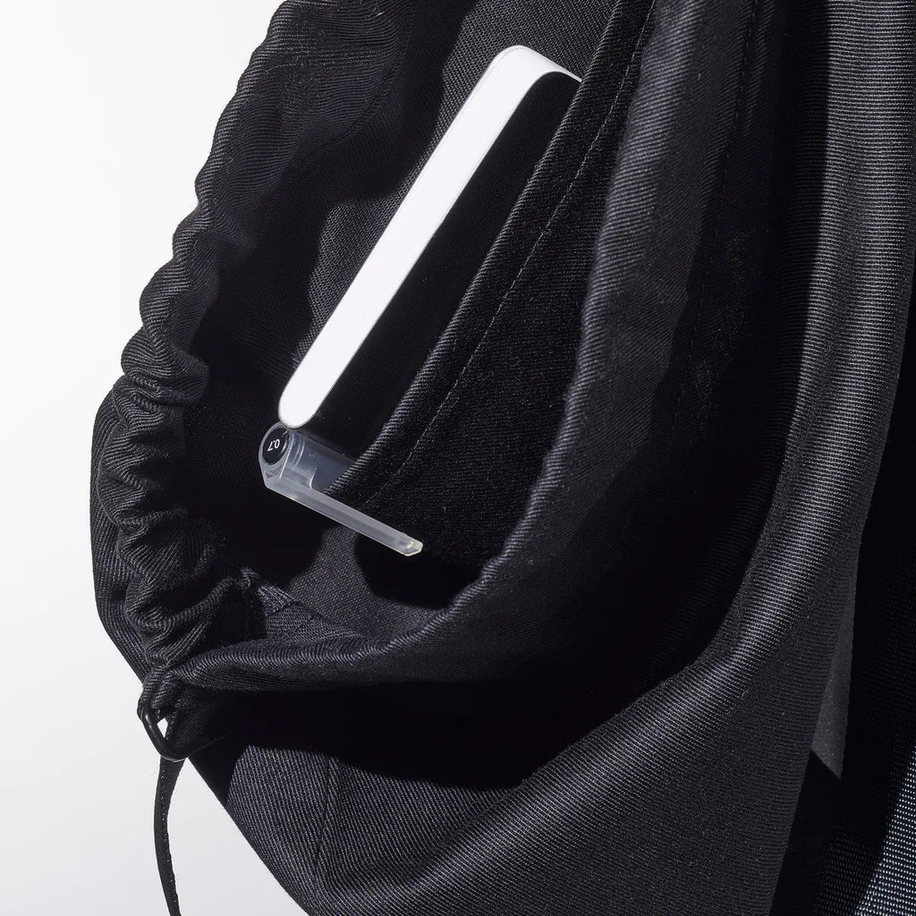 4. Close-up of inside pocket of MARCH Water Resistant Reflective Backpack QR, showing organization feature