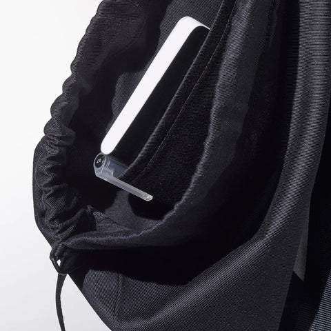 4. Close-up of inside pocket of MARCH Water Resistant Reflective Backpack QR, showing organization feature