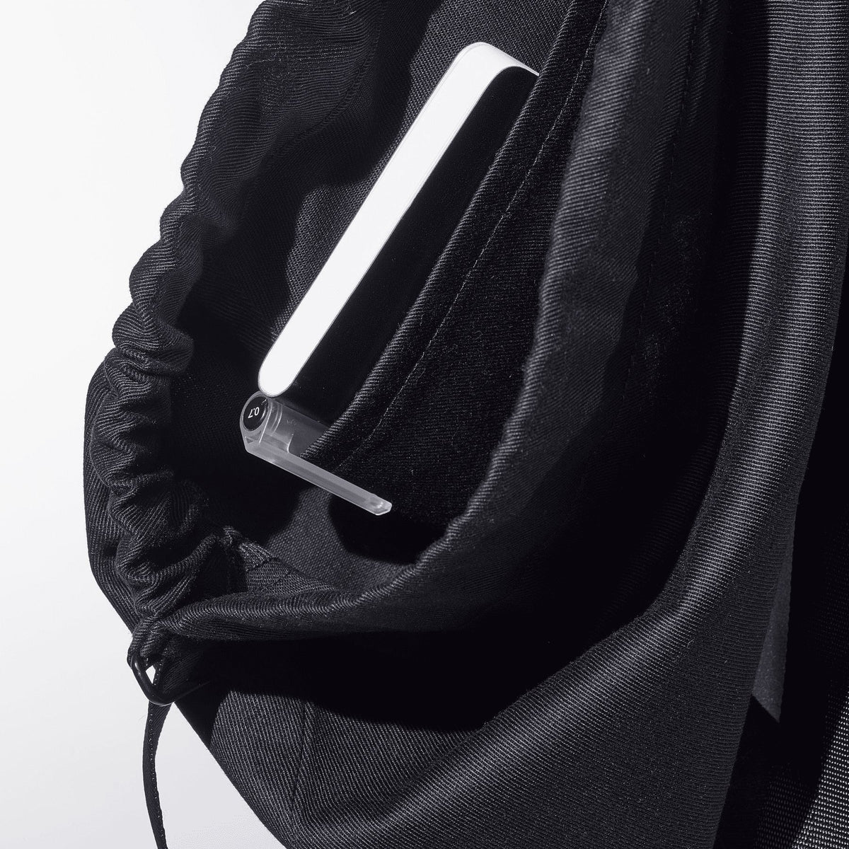 6. Interior view of March Design Studio's Water Resistant Reflective Backpack DOT, showing convenient inside pocket