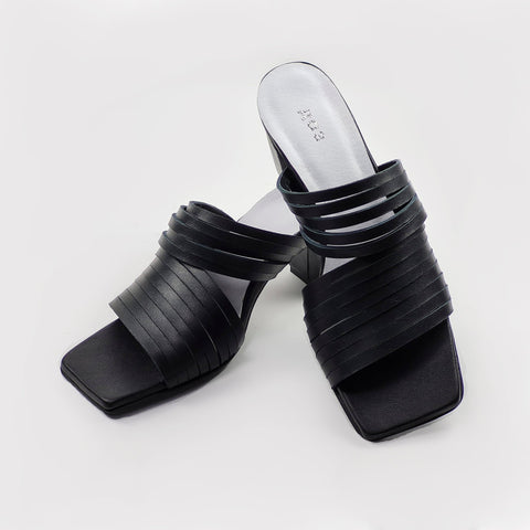 3. Side view of women's black strappy leather sandals with squared toe and 6 cm heel
