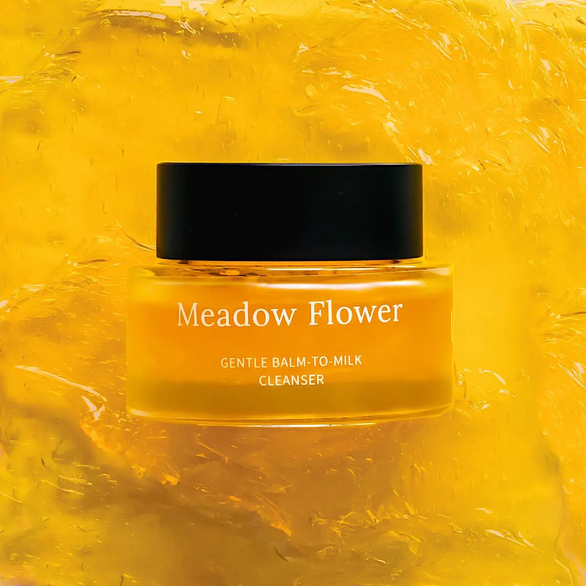1. Usva Cosmetics Meadow Flower Gentle Balm-to-Milk Cleanser in jar, shown on a vibrant yellow background