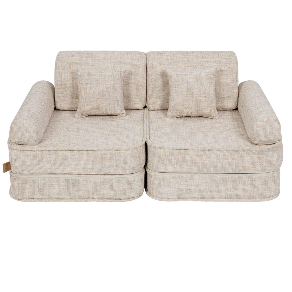 2. Beige modular children's sofa with square cushions, shown in a studio setting