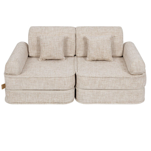 2. Beige modular children's sofa with square cushions, shown in a studio setting